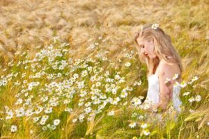 Blond Girl On The Camomile Field