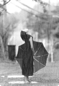 Woman standing in rain